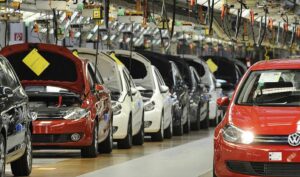 Why is the automobile industry considered an oligopoly ?